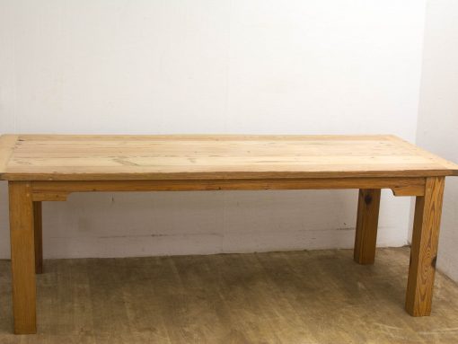 Rustic wooden dining table, perfect for cozy gatherings and versatile in any interior style.