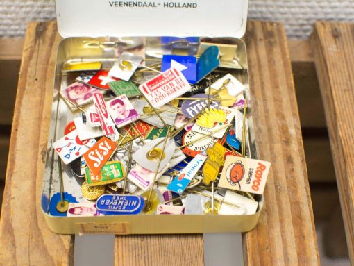 Colorful vintage pins and badges from Veenendaal, Holland, perfect for collectors and history enthusiasts.