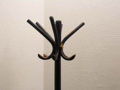 Stylish vintage black coat rack with six curved hooks for modern entryways.