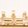 Wooden Three Wise Monkeys sculptures embodying Hears no evil, Sees no evil, Speaks no evil.