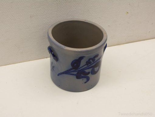 Rustic ceramic pot with bluish floral design, perfect for plants or decorative use.