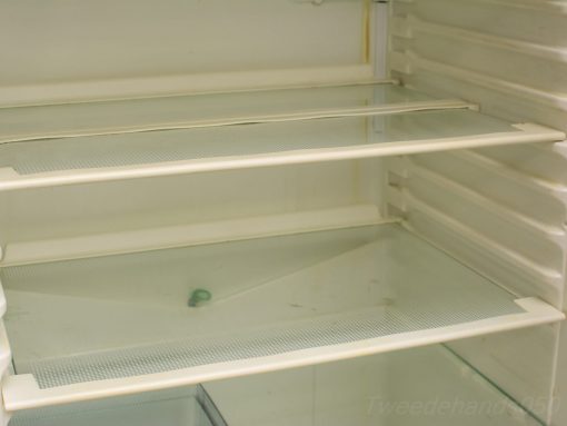 Stylish used refrigerator with glass shelves for modern food storage and visibility.