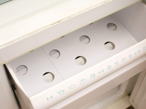 Sleek kitchen drawer with compartments and icons for efficient food organization and storage.