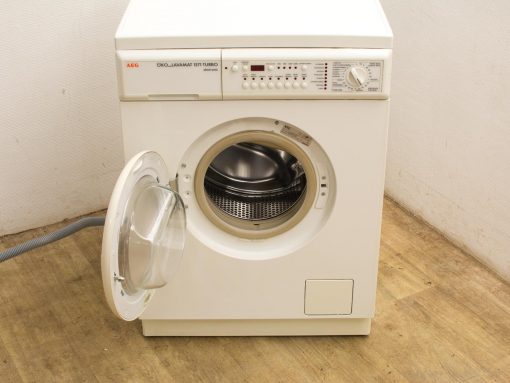 Modern AEG washing machine with transparent door and advanced controls for efficient laundry care.