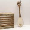 Vintage wooden lute paired with rustic crate, embodying artistry and nostalgia for music lovers.