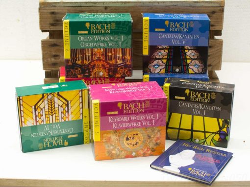 Explore this stunning second-hand collection of Bach CDs, beautifully displayed on rustic wood.