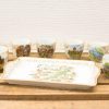 Charming vintage porcelain tray and unique cups showcasing cultural landmarks, perfect for collectors.