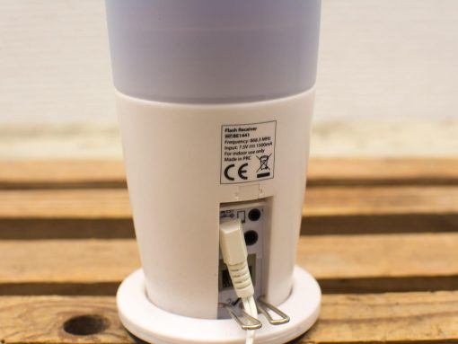 Modern cylindrical flash receiver with translucent top, ideal for creative photography spaces.