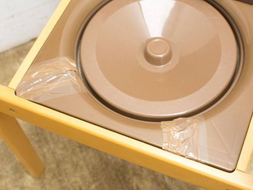 Vintage table with circular bowl, ideal for cooking and crafting activities.