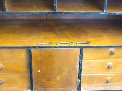 Vintage wooden cabinet with antique keys and elegant design, perfect for adding character to any space.