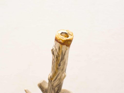 Artistic wooden piece with amber hole, showcasing unique grain and natural textures.