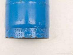 Blue cylindrical gas bottle with markings, weighing 124 kg and dating from March 2003.