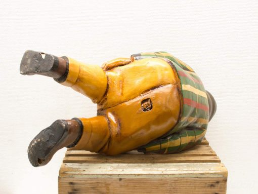 Whimsical colorful wooden clown figurine, perfect for vintage collections or playful decor.