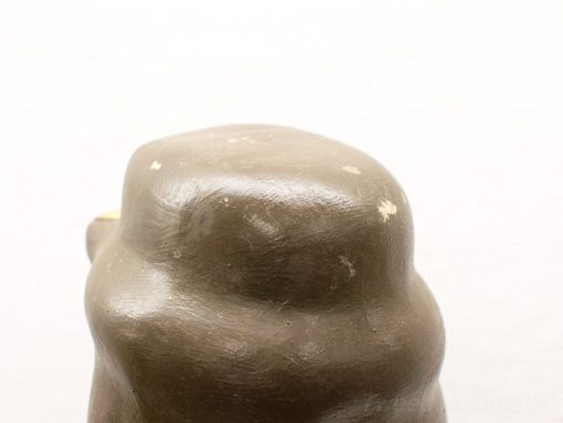 Elegant abstract brown sculpture with glossy finish, embodying warmth and artistic craftsmanship.
