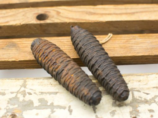 Handcrafted wooden cones with textured spirals, perfect for natural decor and unique accents.