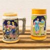 Colorful vintage ceramic mugs featuring cultural designs and intricate craftsmanship, perfect for collections.