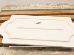 Elegant white ceramic platter with scalloped edges, perfect for stylish serving and presentation.