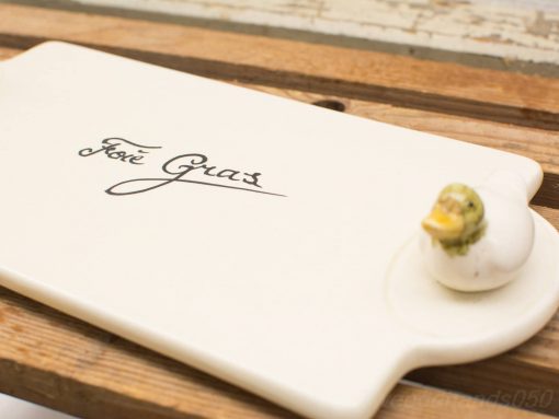 Sophisticated white serving tray with José Gras and colorful ceramic duck accent.