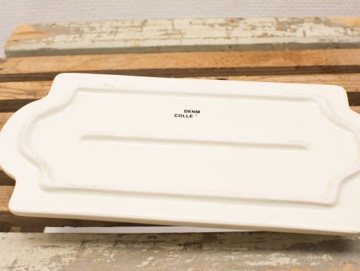 Elegant white ceramic platter with scalloped edges, perfect for stylish serving and presentation.