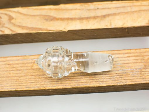 Elegant glass shell decor piece on a wooden surface, showcasing fine craftsmanship and natural beauty.