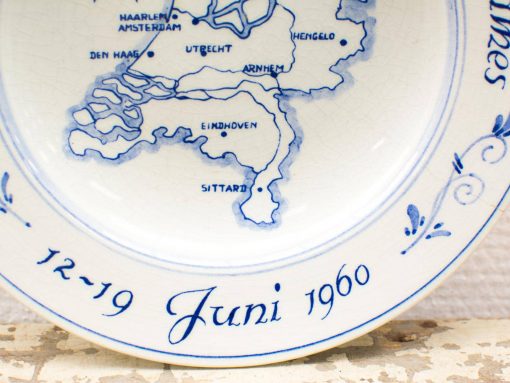 Vintage porcelain plate featuring a map of the Netherlands, dated June 12-19, 1960.