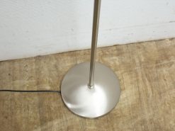 Sleek stainless steel floor lamp with elegant minimalist design and warm ambiance. Perfect for any decor.
