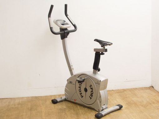 Sleek silver elliptical trainer for home use, featuring adjustable seat and ergonomic handlebars.
