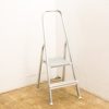 Stylish aluminum stepladder, lightweight and safe, perfect for reaching high places at home.