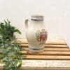 Vintage ceramic pitcher with Königsberg emblem, perfect for decor and rustic charm.
