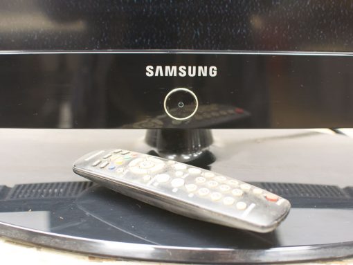 Sleek Samsung TV with remote, perfect for modern living room entertainment.