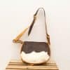 Unique vintage leather crossbody bag with fur, featuring stylish design and adjustable strap.