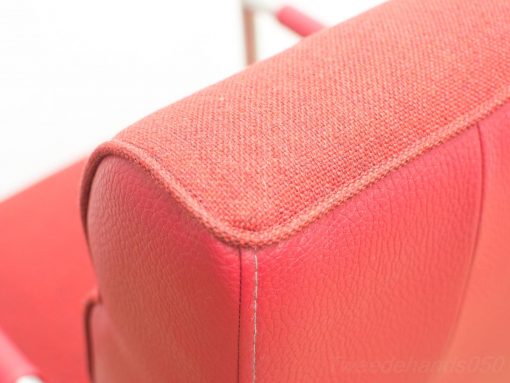 Bold red modern chair with premium craftsmanship, perfect for contemporary interiors.