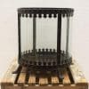 Vintage glass lantern with ornate metal frame, perfect for stylish candle or flower displays.