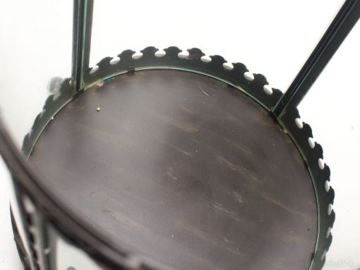 Elegant lantern with glass panels and a decorative metal edge for stylish ambiance.