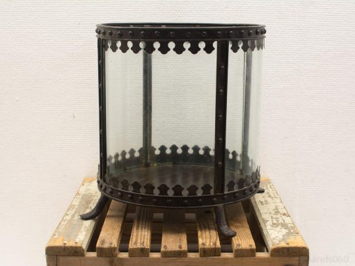Vintage glass lantern with ornate metal frame, perfect for stylish candle or flower displays.