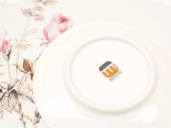 Elegant vintage porcelain flower plate by Monopoly, featuring delicate pink roses and green leaves.