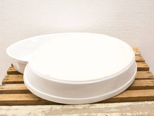 Modern white storage containers on rustic wood, perfect for stylish organization.