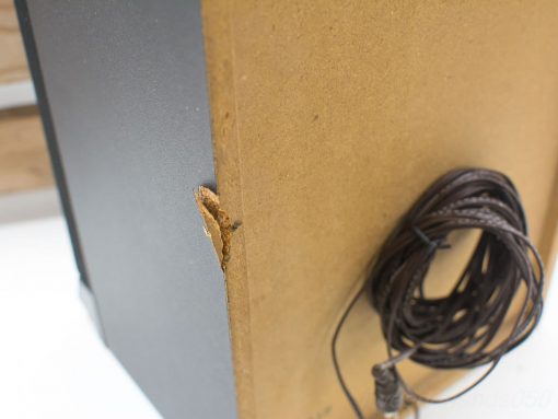 Stylish vintage Philips speakers with damage, featuring a coiled cable for practicality.