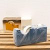 Sleek vintage blue tape dispenser with white accents, ideal for stylish office organization.