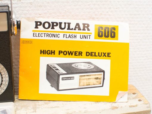 Vintage Popular 606 flash unit, iconic yellow design, perfect for photography enthusiasts.