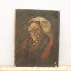 Portrait of an elderly woman in earthy tones, showcasing wisdom and character through her attire.