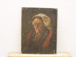 Portrait of an elderly woman in earthy tones, showcasing wisdom and character through her attire.
