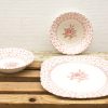 Vintage rose porcelain tableware set, featuring elegant bowls and plates for charming dining experiences.