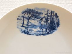 Graceful stag in serene blue landscape on decorative Veluwe porcelain plate.