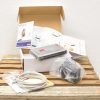 Unboxed Sitecom xDSL/Cable Router with accessories, elegantly displayed on rustic wood.