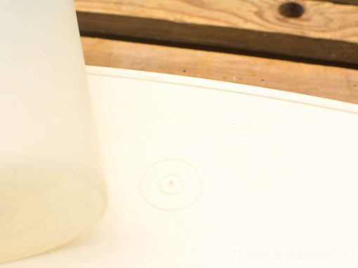 Stylish circular container with a transparent jug, perfect for modern kitchen aesthetics.