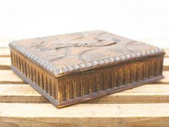 Antique wooden decorative box with intricate patterns and elegant craftsmanship, perfect for vintage collectors.