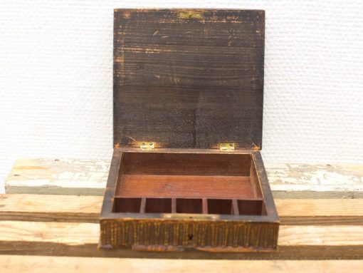 Antique wooden box with compartments, perfect for storing jewelry and small collectibles.