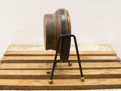 Antique bronze decor piece with a minimalist black stand, perfect for vintage enthusiasts.