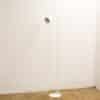 Elegant minimalist white floor lamp enhancing modern interiors with sleek design and functional lighting.